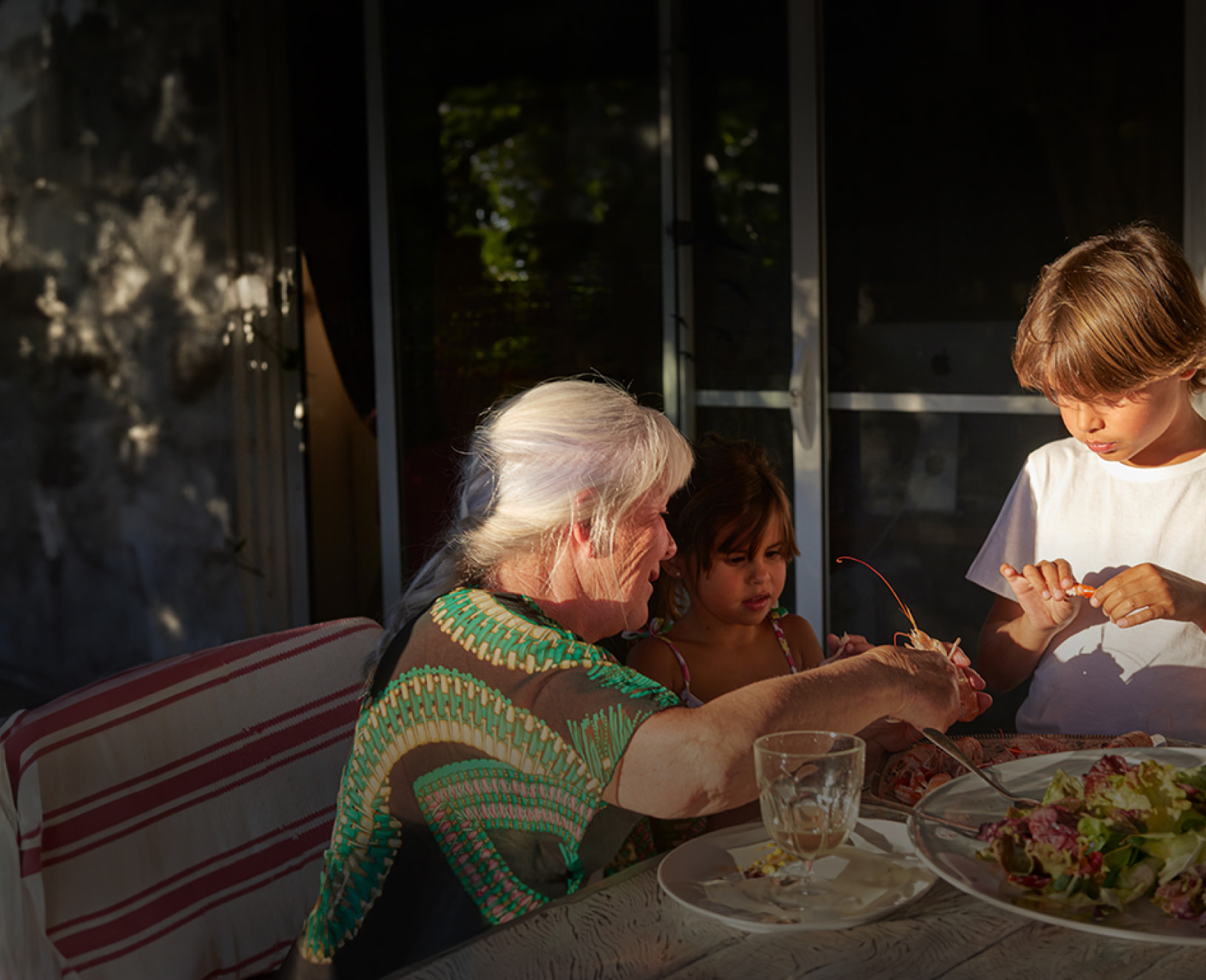 Family enjoying a mean outside