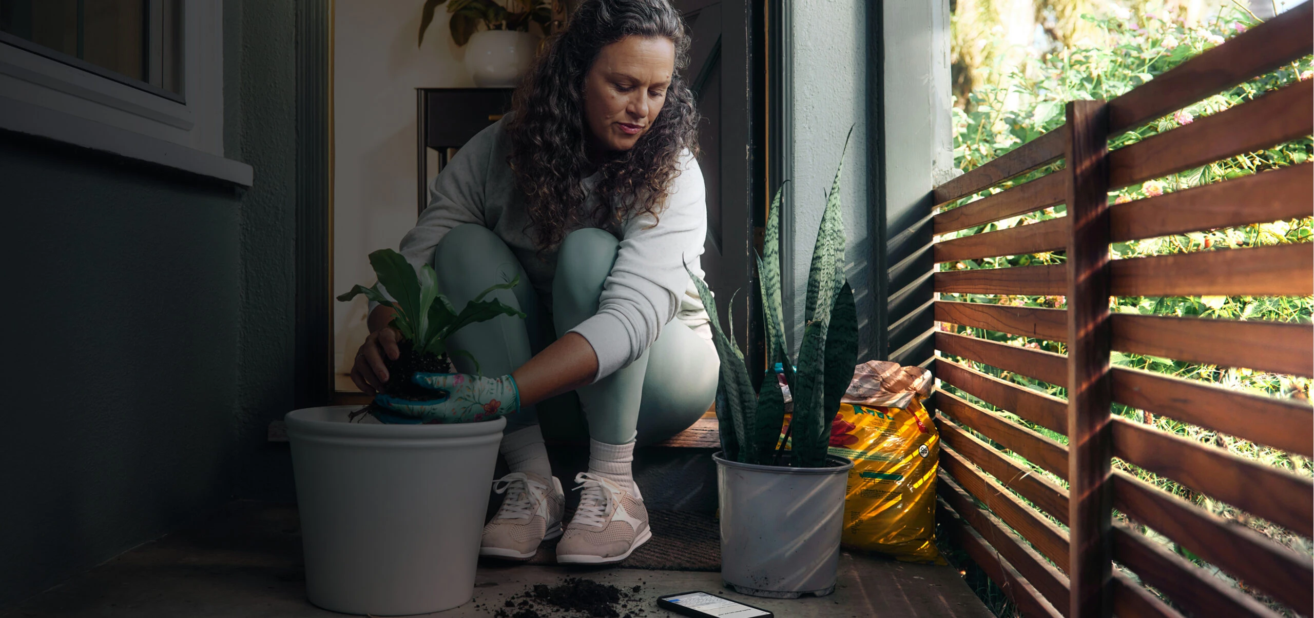 Woman planing planing on her patio.