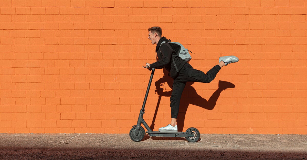 Man on scooter excited to learn about the Inflation Reduction Act.